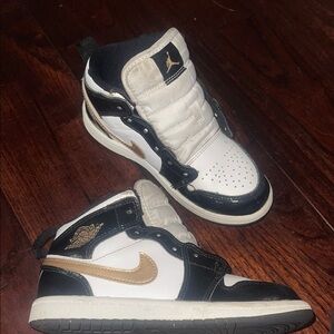 Jordan Black and Gold High-Top Sneakers
